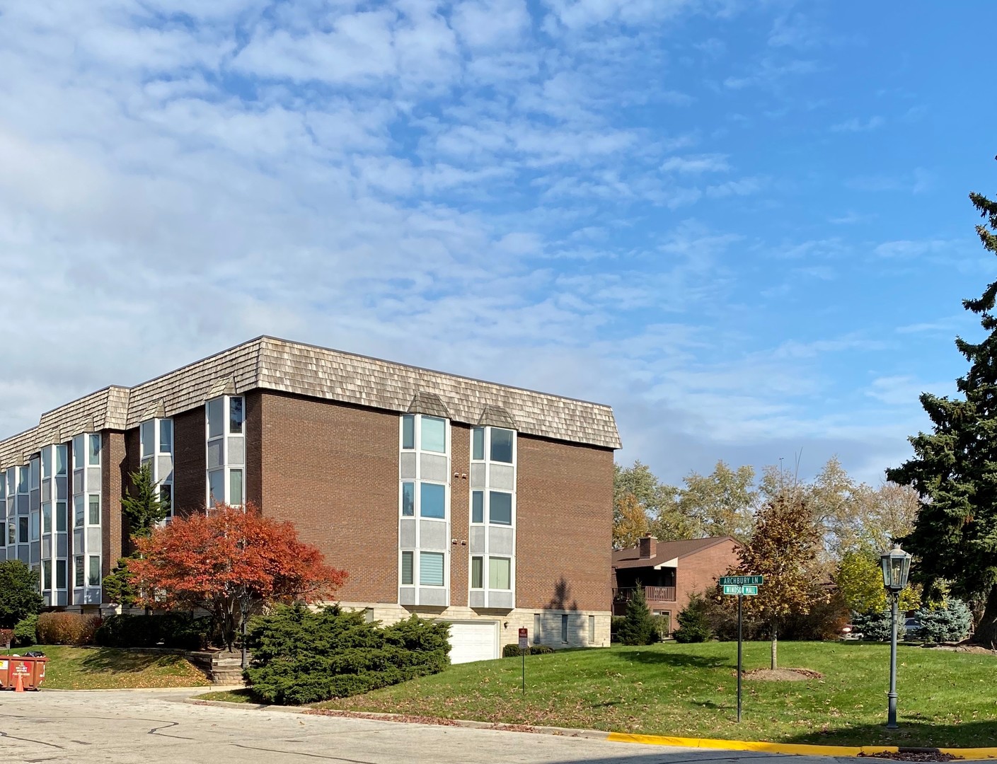 2400 Windsor Mall, Unit 1K Park Ridge, IL 60068 - Photo 1 of 13 a front view of a house with a yard