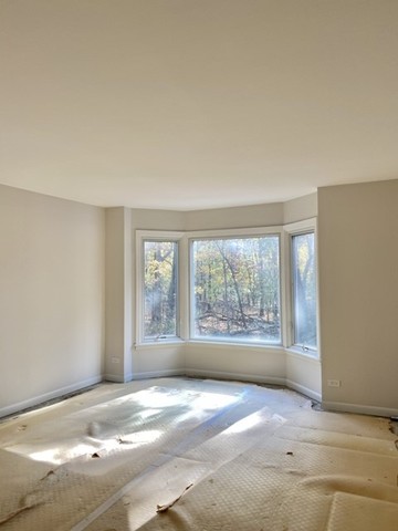 2400 Windsor Mall, Unit 1K Park Ridge, IL 60068 - Photo 5 of 13 a view of an empty room with a window