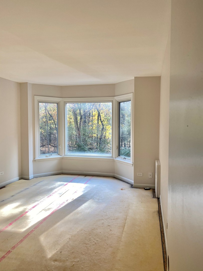 2400 Windsor Mall, Unit 1K Park Ridge, IL 60068 - Photo 6 of 13 a view of empty room with front door