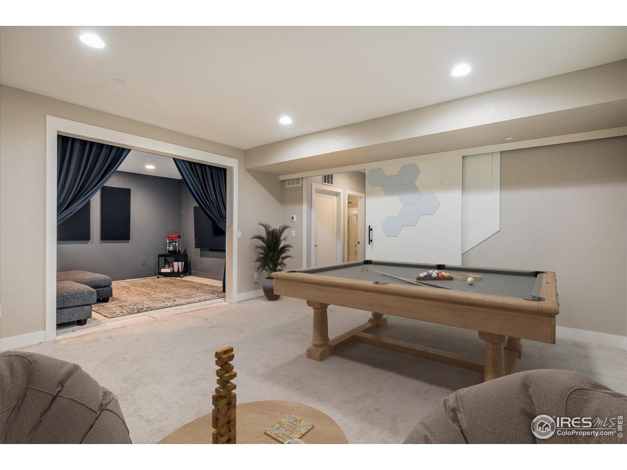 10121 Flower Street Westminster, CO 80021 - Photo 32 of 40 a finished basement with abundant space for living, entertaining and everyday comfort enhancing the home's versatility // virtually staged