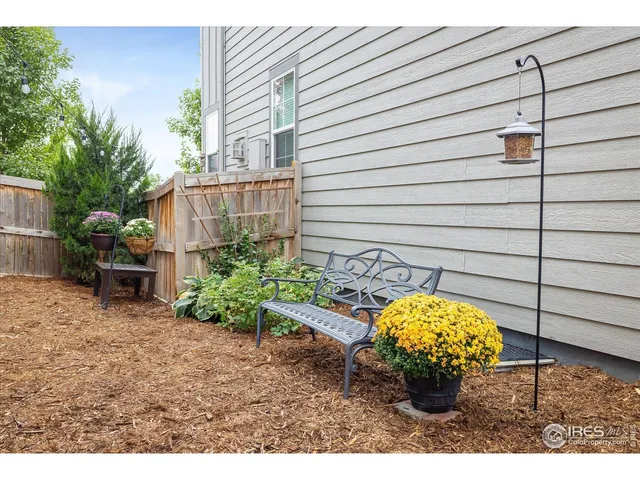 a view of a backyard with sitting area