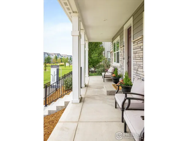 a lobby with furniture and floor to ceiling window