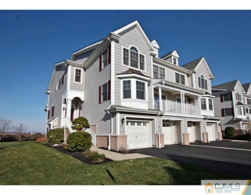 36 Raritan Reach Road South Amboy, NJ 08879 - Photo 1 of 22 a front view of a residential apartment building with a yard