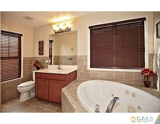 36 Raritan Reach Road South Amboy, NJ 08879 - Photo 14 of 22 a bathroom with a bathtub sink and toilet