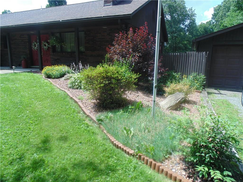 138 Reiber Road Renfrew, PA 16053 - Photo 2 of 20 Admire the lush landscaping as you walk up the sidewalk to the covered front porch.