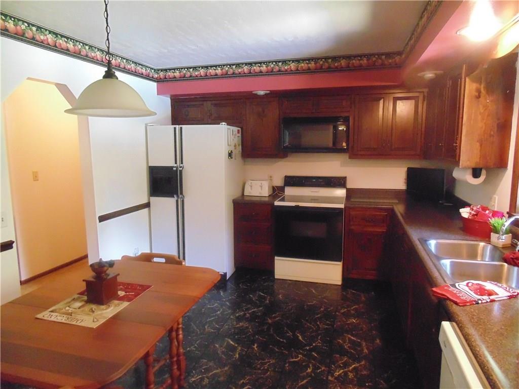 138 Reiber Road Renfrew, PA 16053 - Photo 9 of 20 The large kitchen features an eat-in area, and plenty of room for several "cooks in the kitchen".