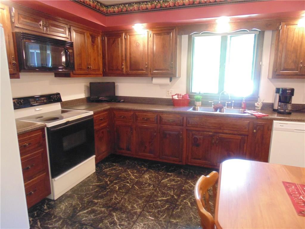 138 Reiber Road Renfrew, PA 16053 - Photo 10 of 20 Views of the welcoming backyard and pool won't disappoint while preparing meals for family and friends!
