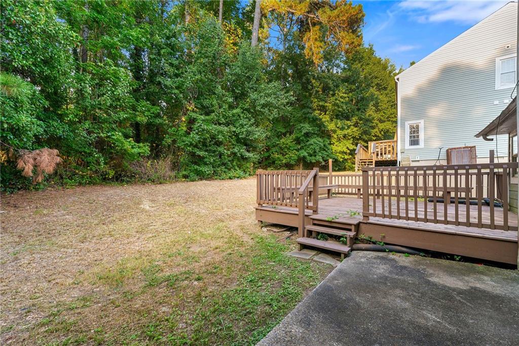2575 Picardy Circle North, Unit B Atlanta, GA 30349 - Photo 20 of 20 a view of a bench in backyard