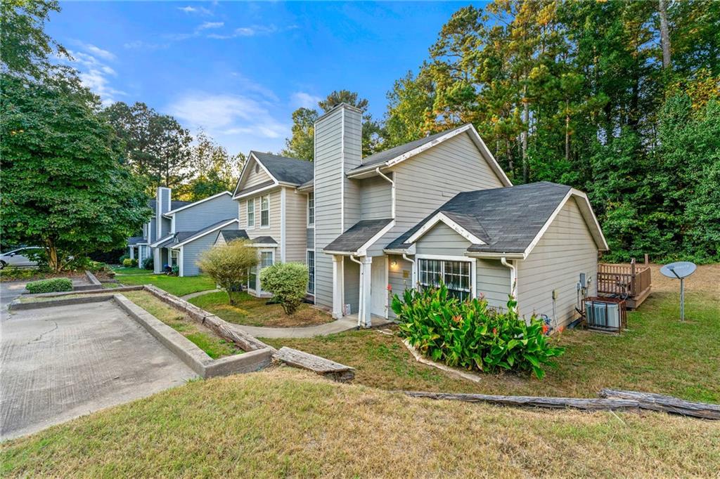 2575 Picardy Circle North, Unit B Atlanta, GA 30349 - Photo 2 of 20 front view of a house with a yard