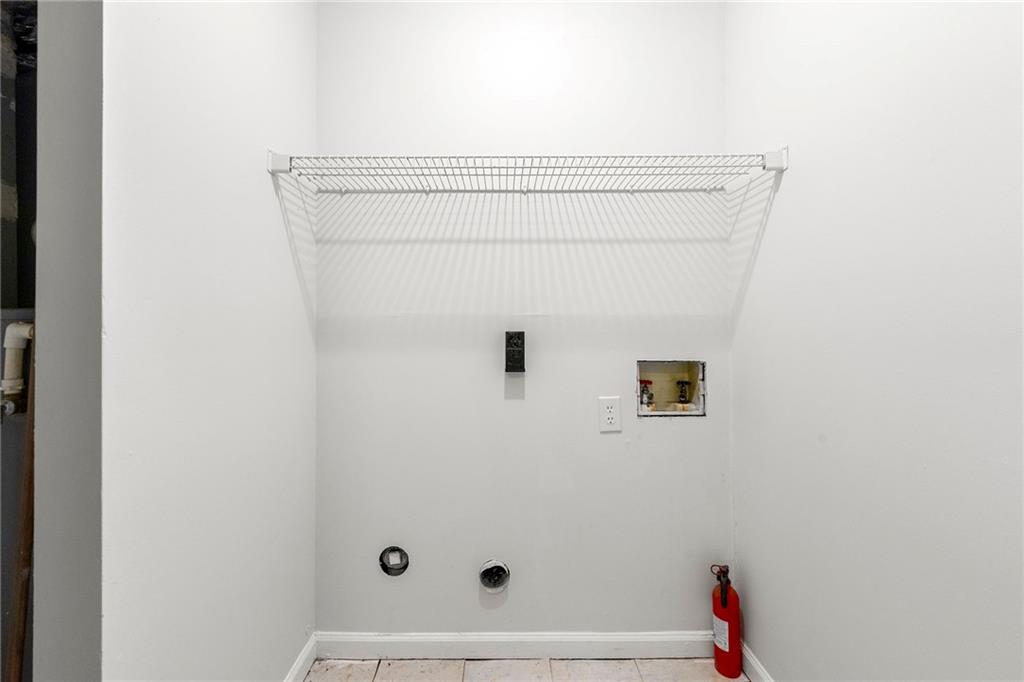 2575 Picardy Circle North, Unit B Atlanta, GA 30349 - Photo 10 of 20 a bathroom with a shower