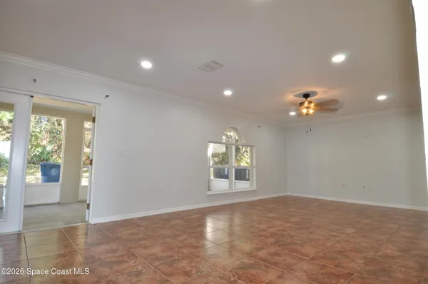 a view of an empty room with a window