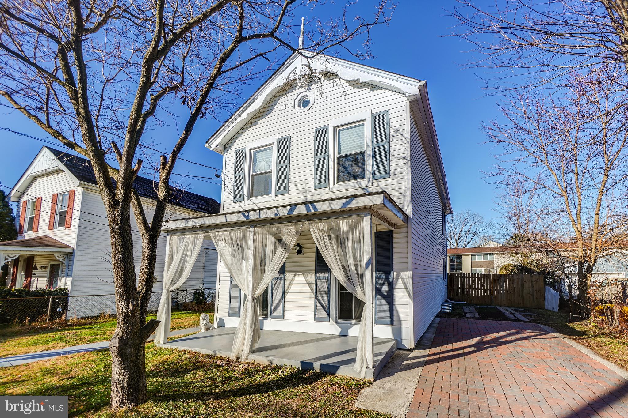 35 4th Street Laurel, MD 20707 - Photo 2 of 31 a front view of a house with a yard