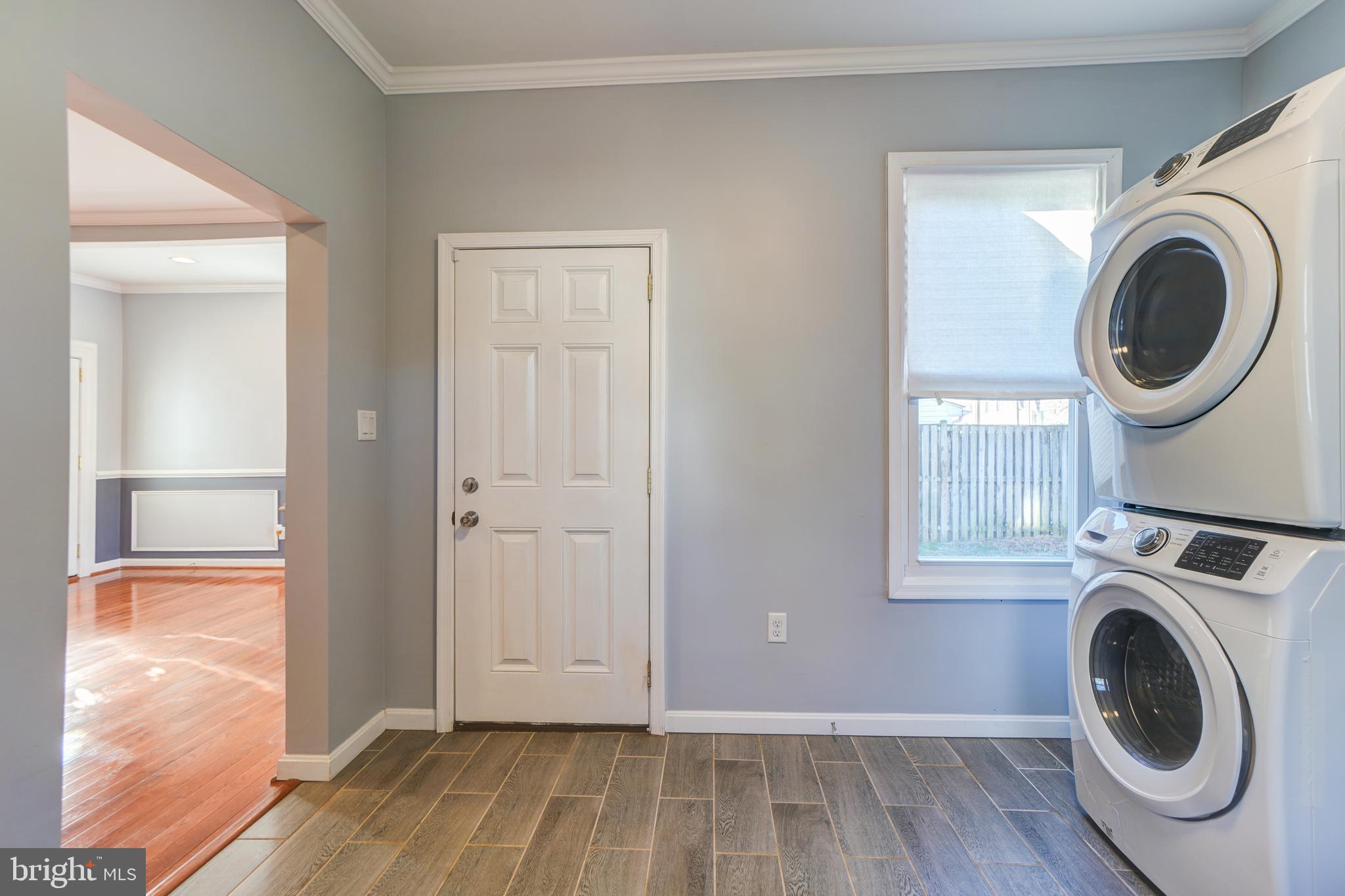 35 4th Street Laurel, MD 20707 - Photo 16 of 31 a view of a hallway with washer and dryer