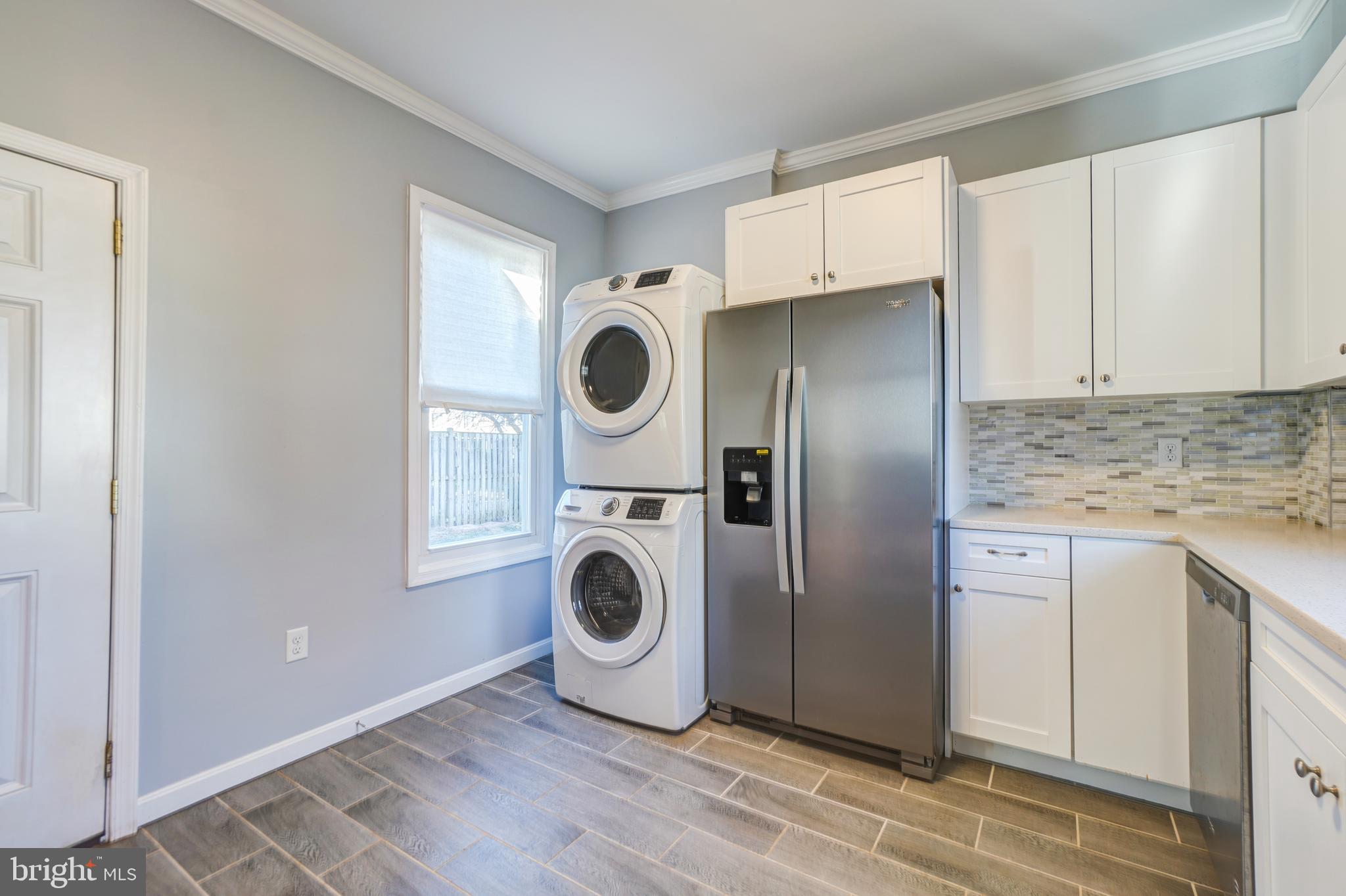 35 4th Street Laurel, MD 20707 - Photo 17 of 31 a kitchen with a refrigerator and a sink