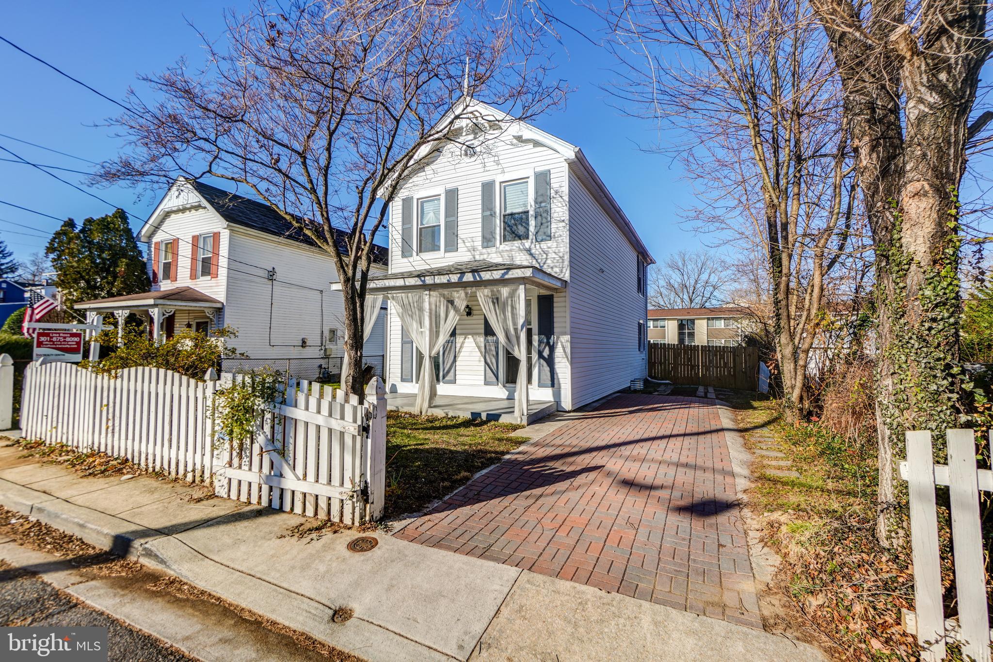 35 4th Street Laurel, MD 20707 - Photo 3 of 31 a front view of a house with wooden fence