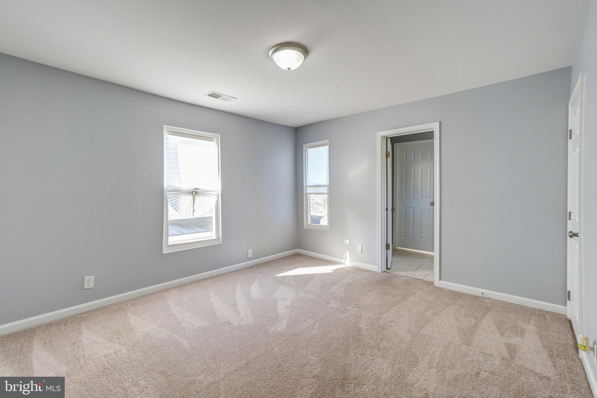 35 4th Street Laurel, MD 20707 - Photo 21 of 31 a view of an empty room with a window