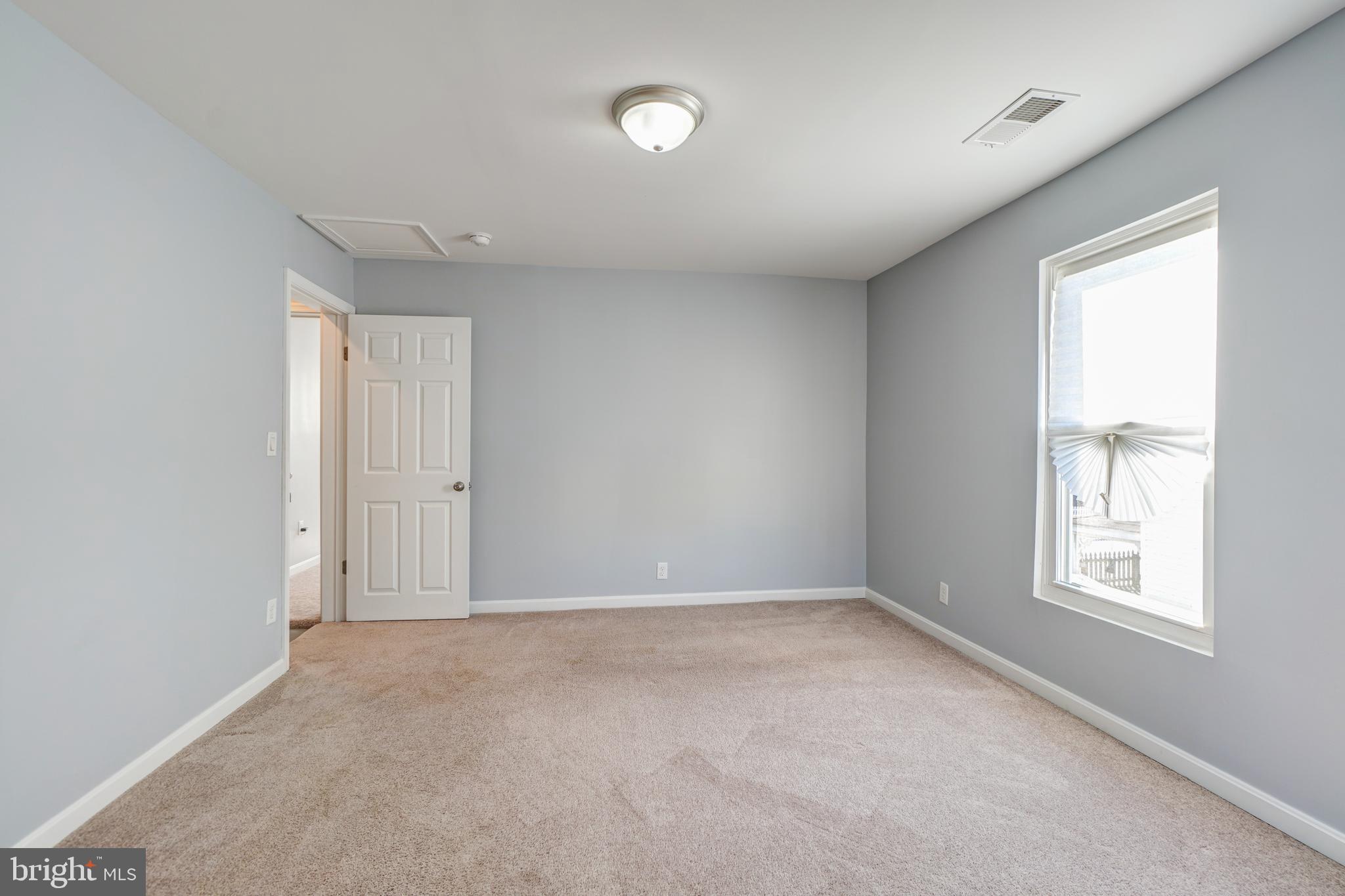 35 4th Street Laurel, MD 20707 - Photo 23 of 31 an empty room with windows and closet