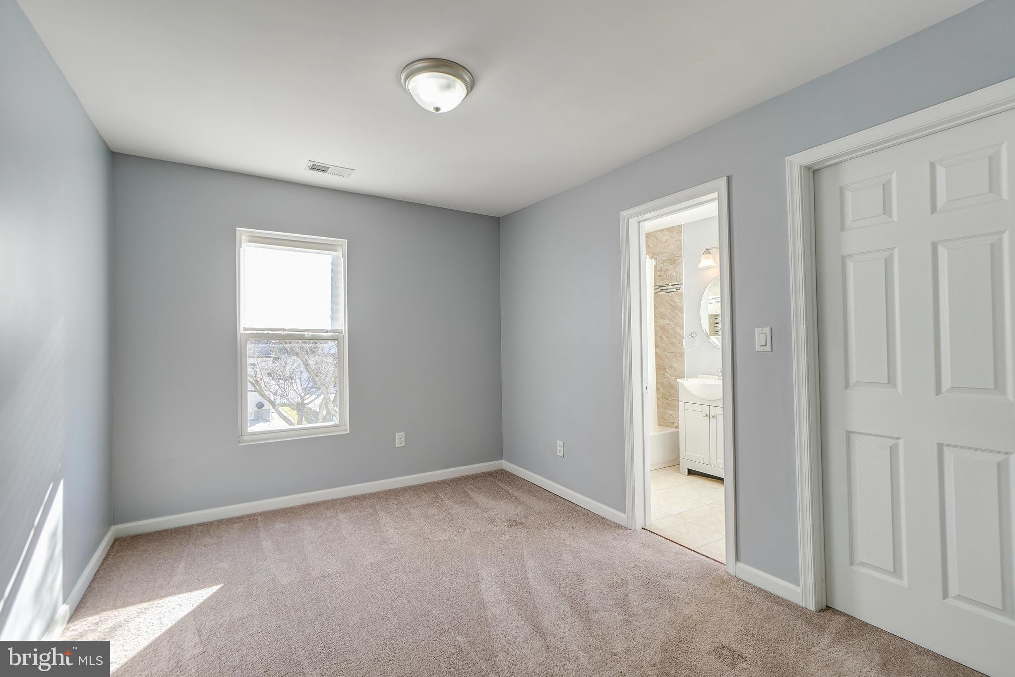 35 4th Street Laurel, MD 20707 - Photo 28 of 31 an empty room with windows and closet
