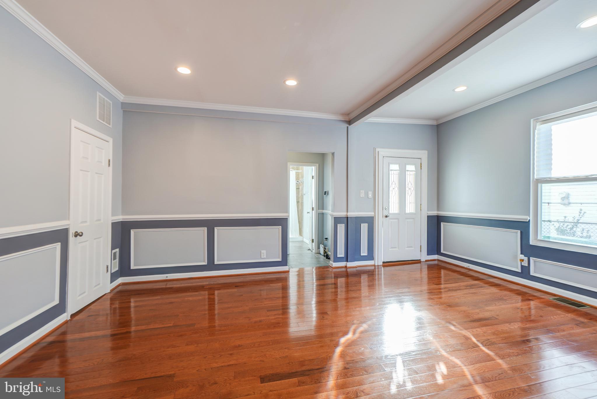 35 4th Street Laurel, MD 20707 - Photo 8 of 31 a view of an empty room with window and wooden floor