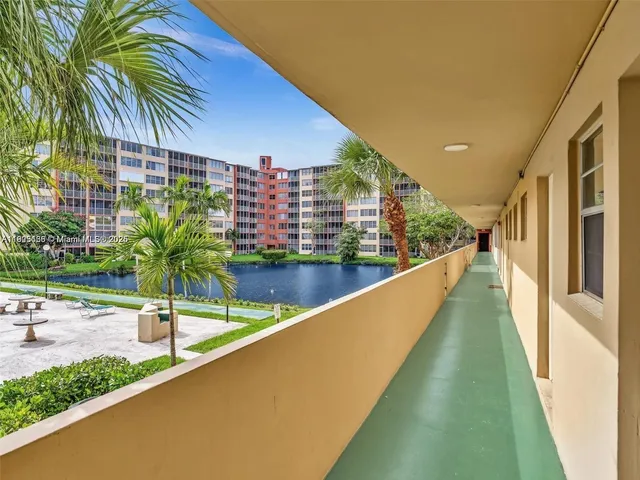 a bathroom with double sink and a mirror