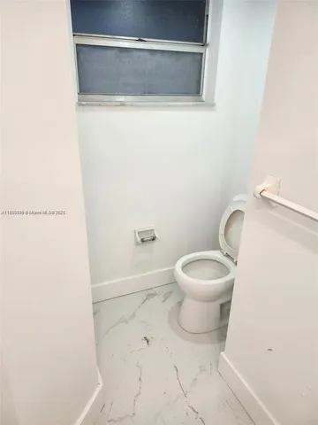 a utility room with a sink washer and dryer