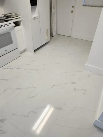 a view of work space with furniture and wooden floor