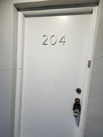 an aerial view of a house with a yard and garden