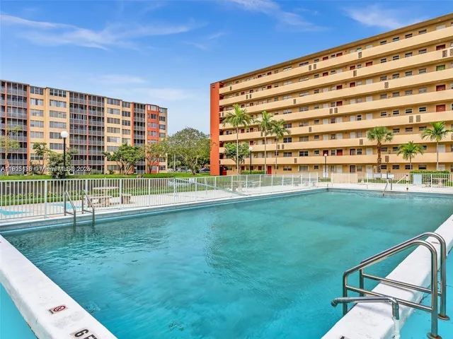 a view of swimming pool from a balcony