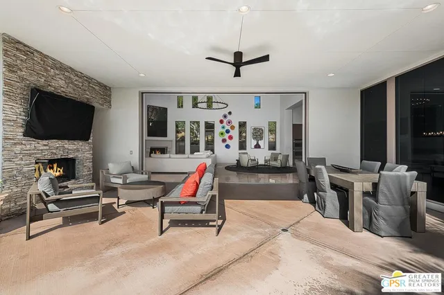 a kitchen with stainless steel appliances granite countertop a stove top oven a sink and a microwave