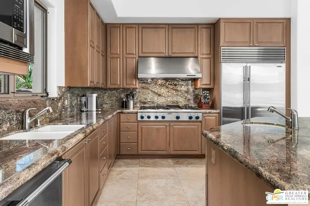 a spacious bathroom with a tub double sink and a large mirror