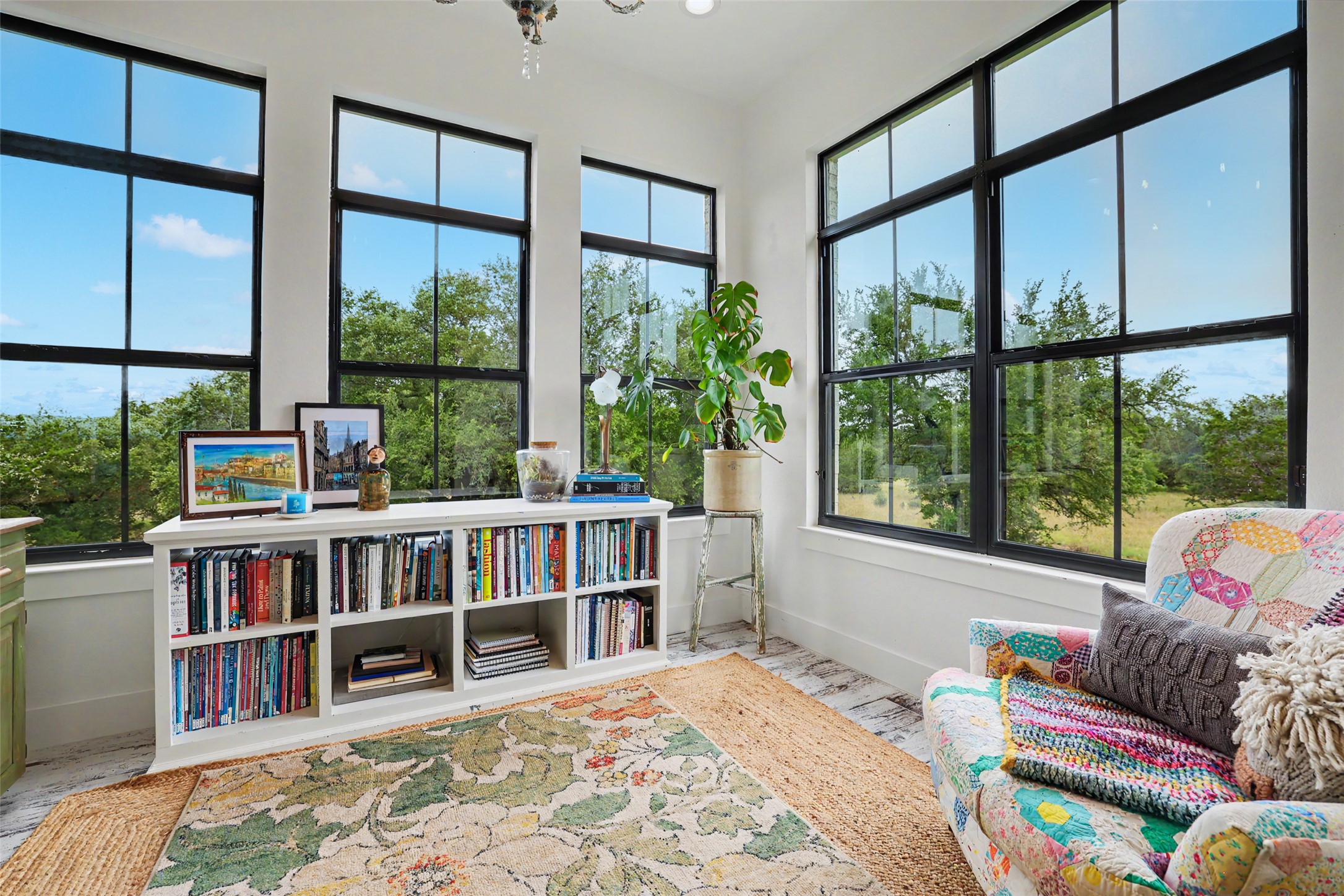 7670 Shiny Top Ranch Lane Salado, TX 76571 - Photo 19 of 40 a living room with large window and a book shelf