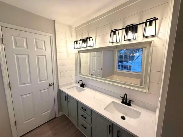 a bathroom with a sink and a window