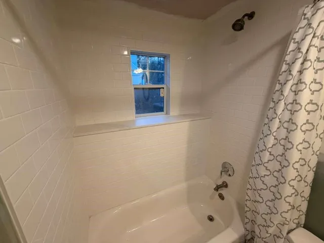 a bathroom with a bathtub