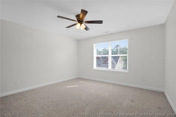 a view of a big room with wooden floor closet and windows