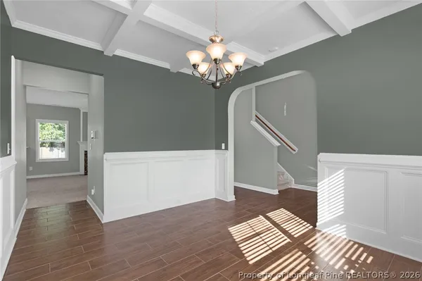 a view of empty room with fireplace