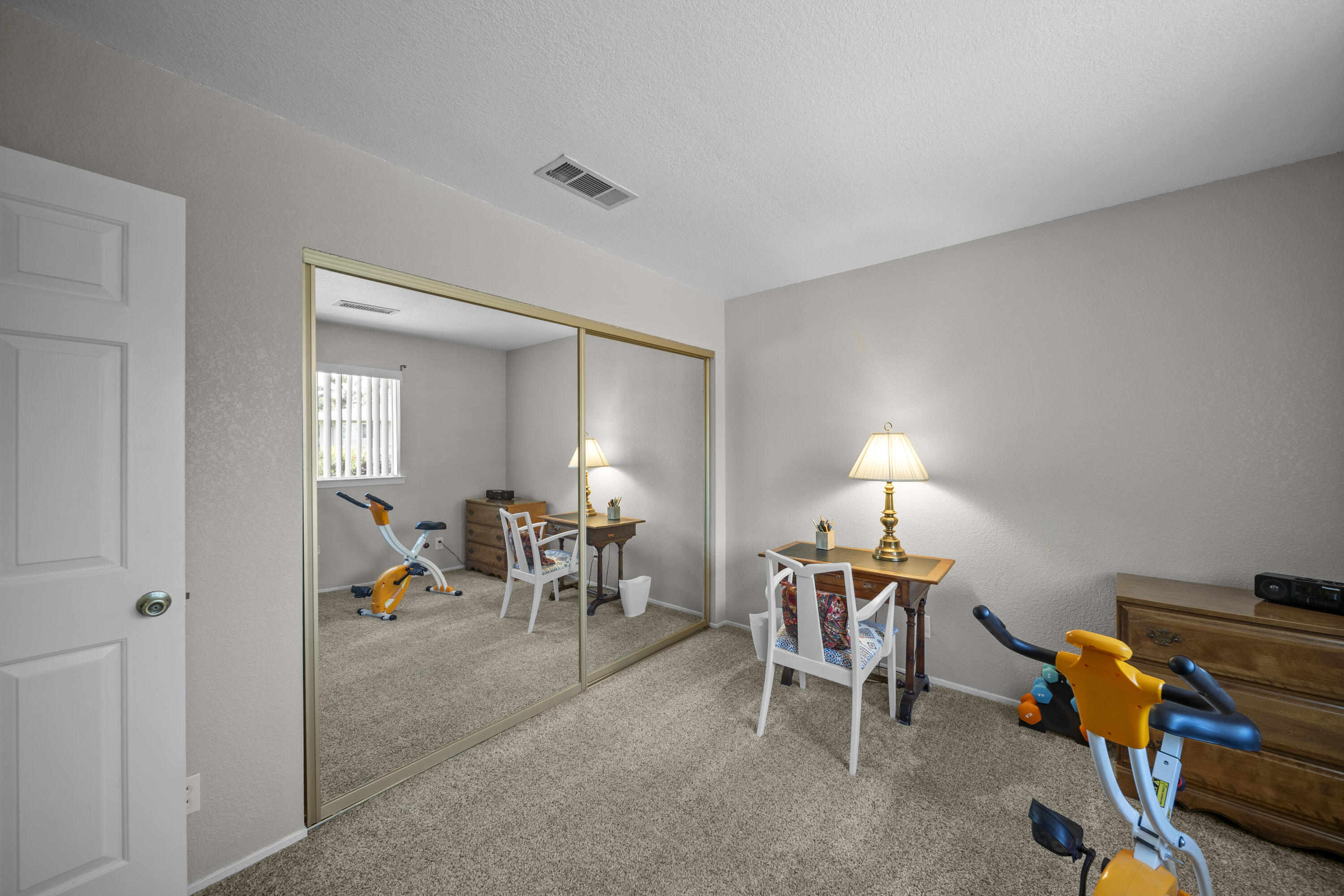 200 Ridgetop Drive, Unit 26 Redding, CA 96003 - Photo 16 of 27 a living room with furniture a dining table and with chairs