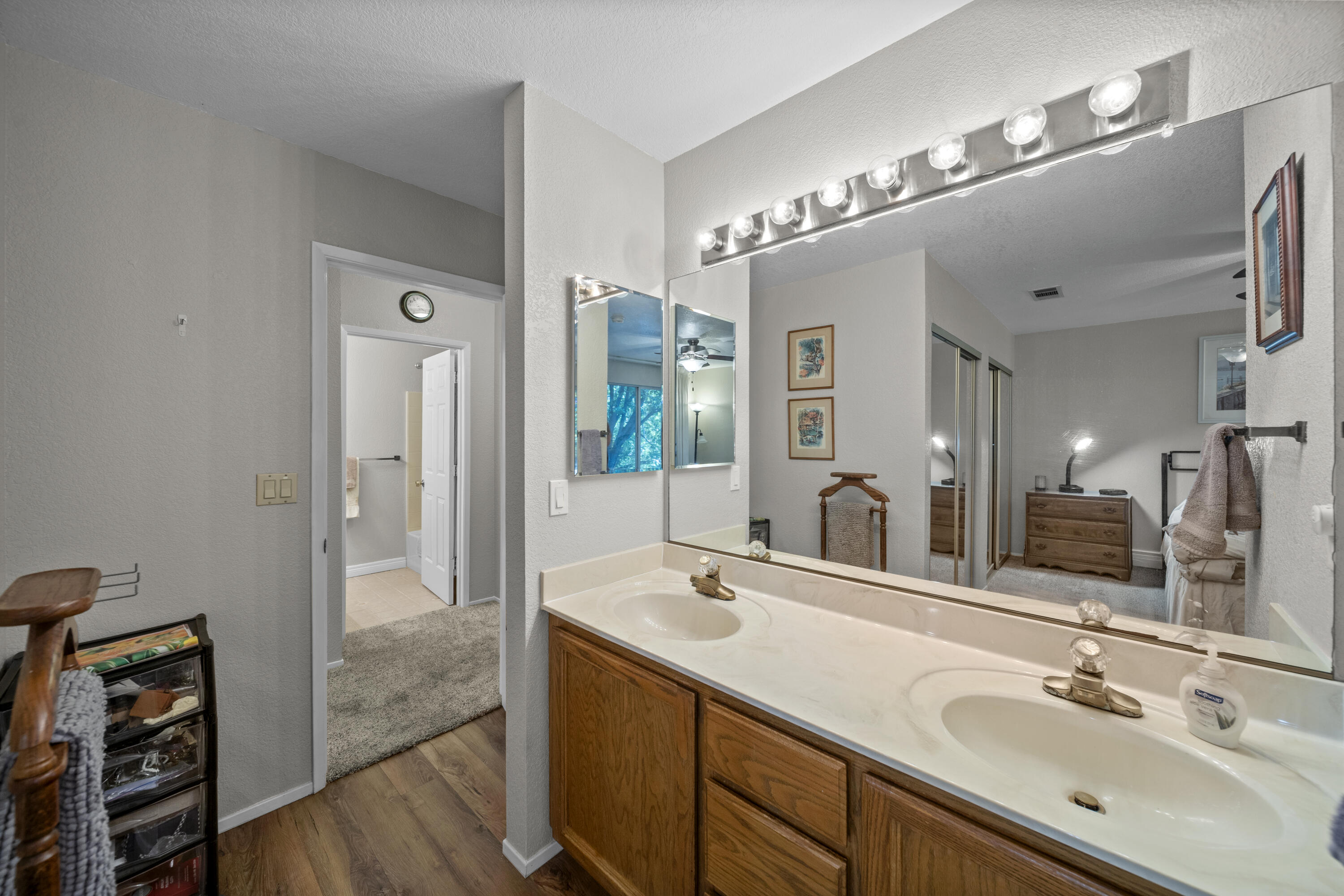 200 Ridgetop Drive, Unit 26 Redding, CA 96003 - Photo 17 of 27 a bathroom with a double vanity sink and a mirror