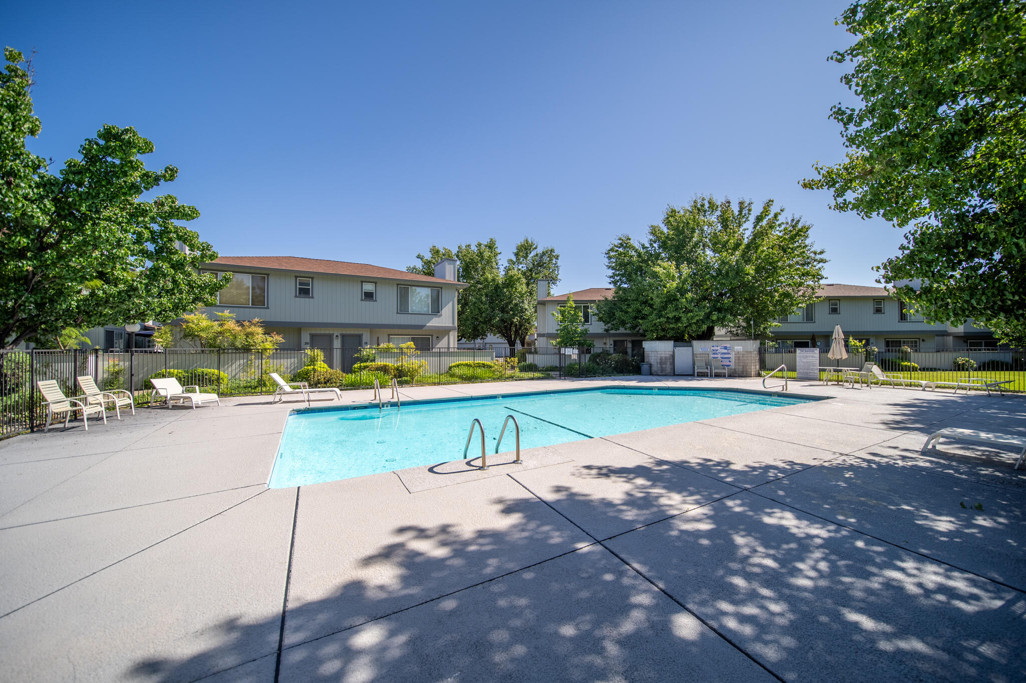 200 Ridgetop Drive, Unit 26 Redding, CA 96003 - Photo 23 of 27 a view of swimming pool with outdoor seating and yard in the back