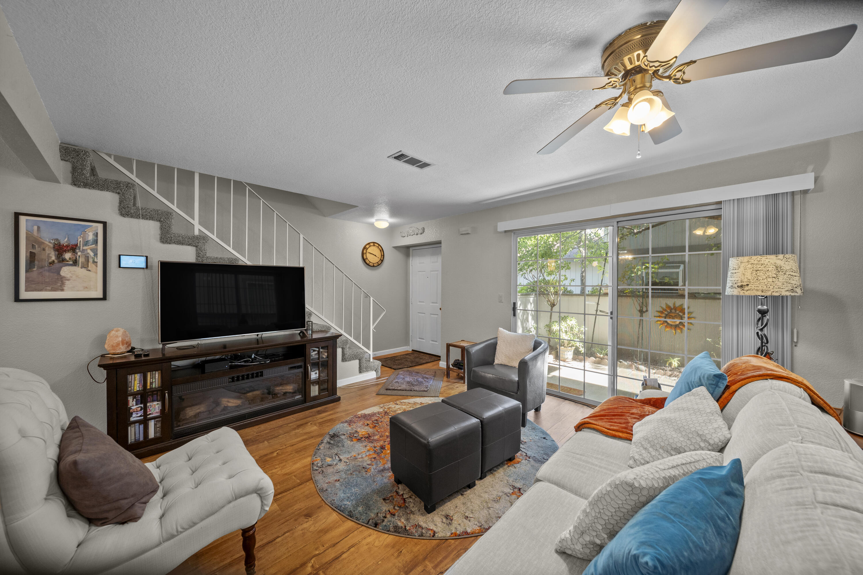 200 Ridgetop Drive, Unit 26 Redding, CA 96003 - Photo 5 of 27 a living room with furniture and a flat screen tv