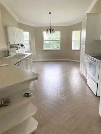 a kitchen with sink and window