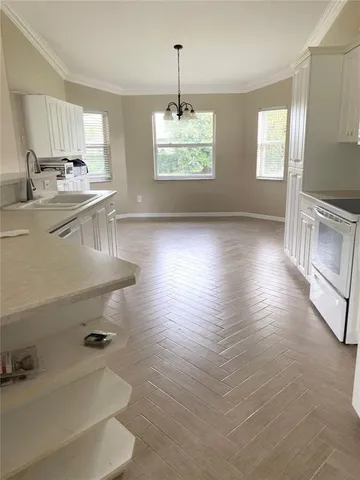 a kitchen with sink and window