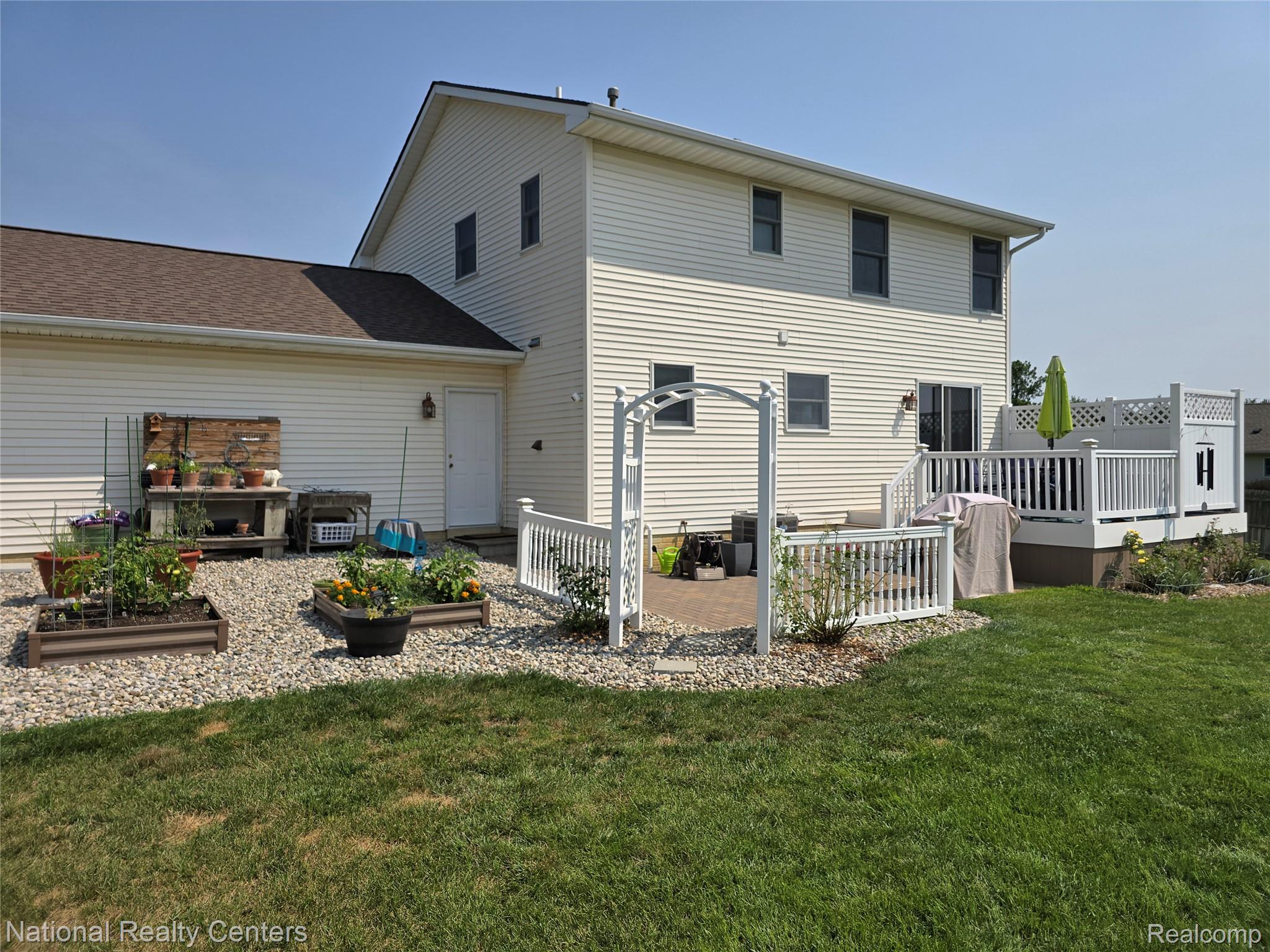 3153 Cobblestone Ridge Tecumseh, MI 49286 - Photo 3 of 23 backside of home