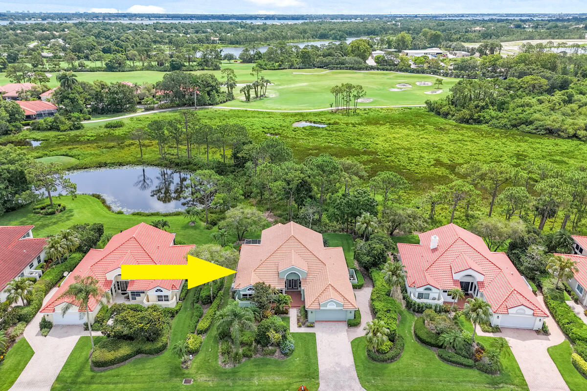 an aerial view of lake residential houses with outdoor space and pool