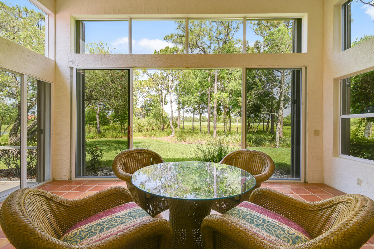13312 Northwest Maplewood Road Palm City, FL 34990 - Photo 15 of 69 a living room with furniture and a window