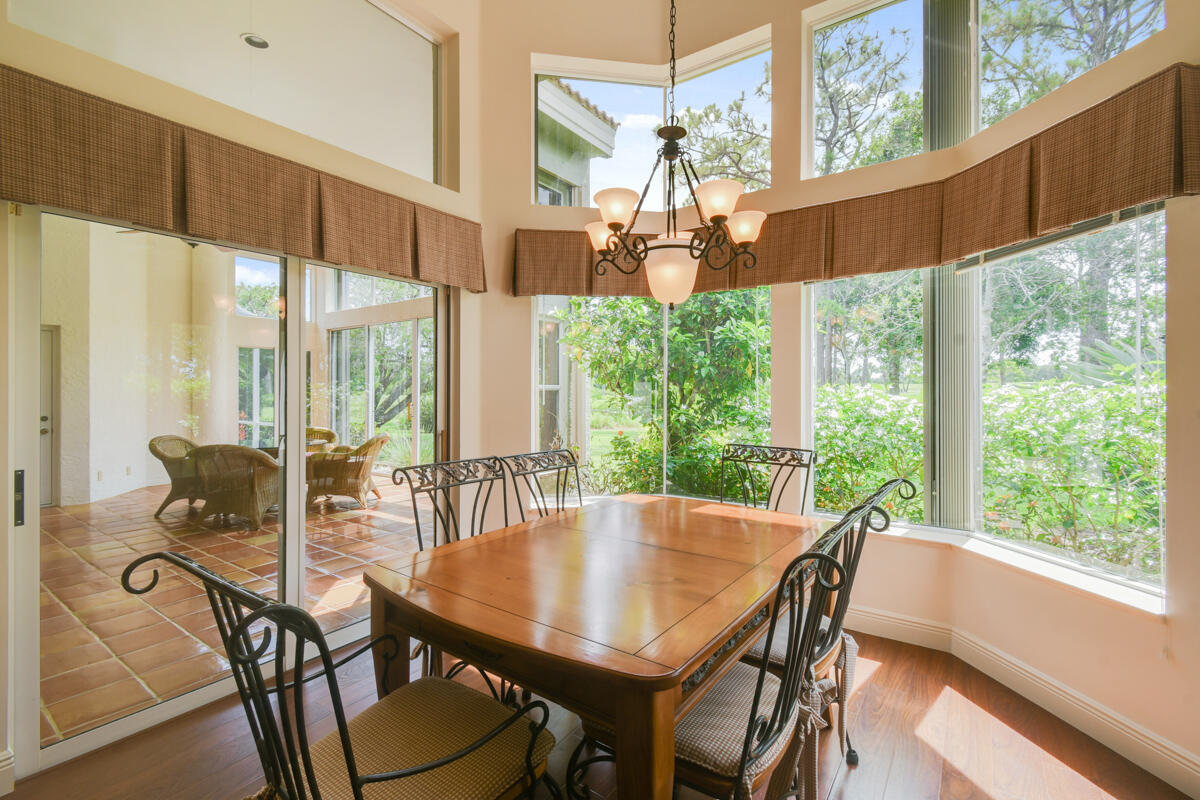 13312 Northwest Maplewood Road Palm City, FL 34990 - Photo 17 of 69 a view of a dining room with furniture window and outside view