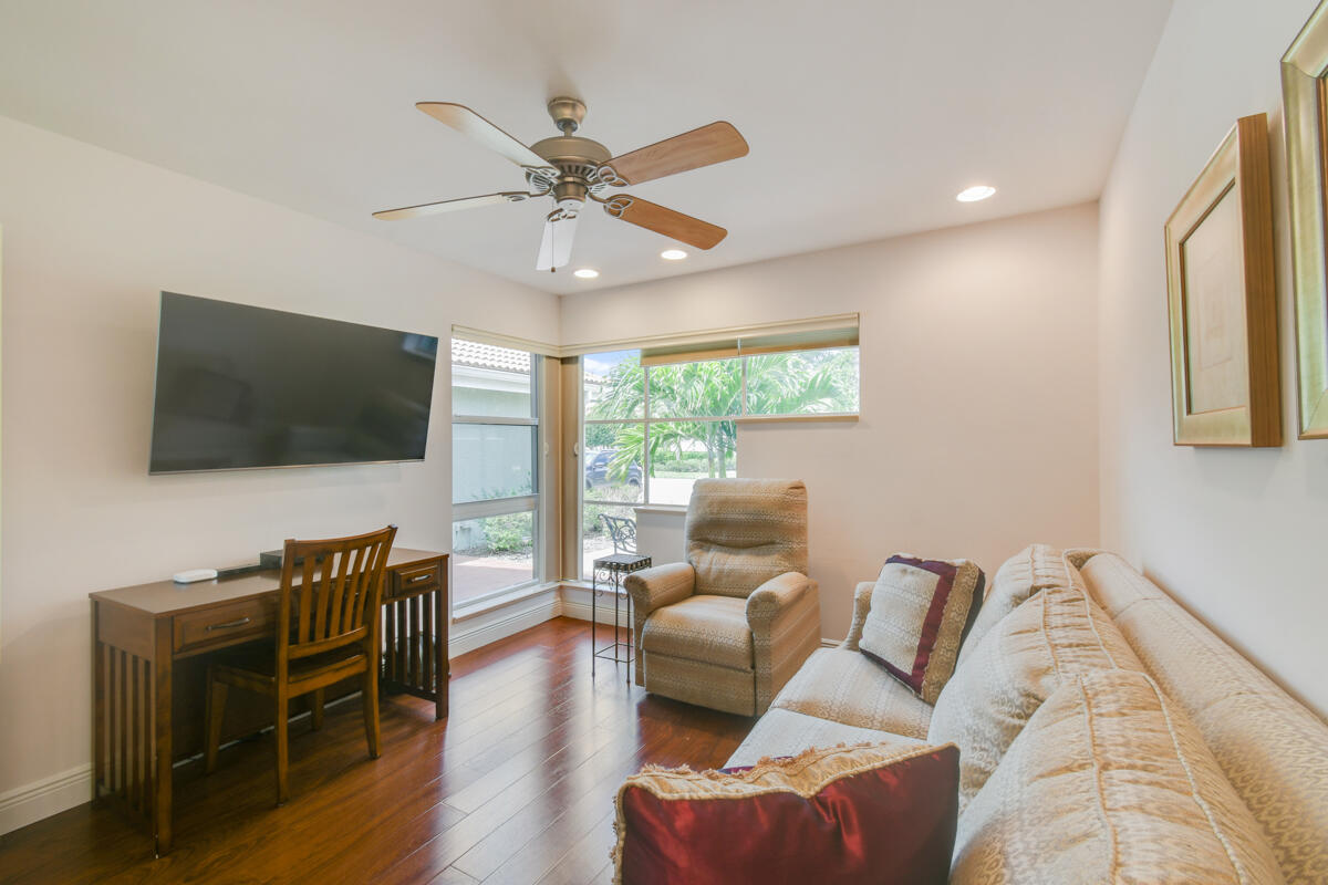 13312 Northwest Maplewood Road Palm City, FL 34990 - Photo 24 of 69 a living room with furniture and a flat screen tv