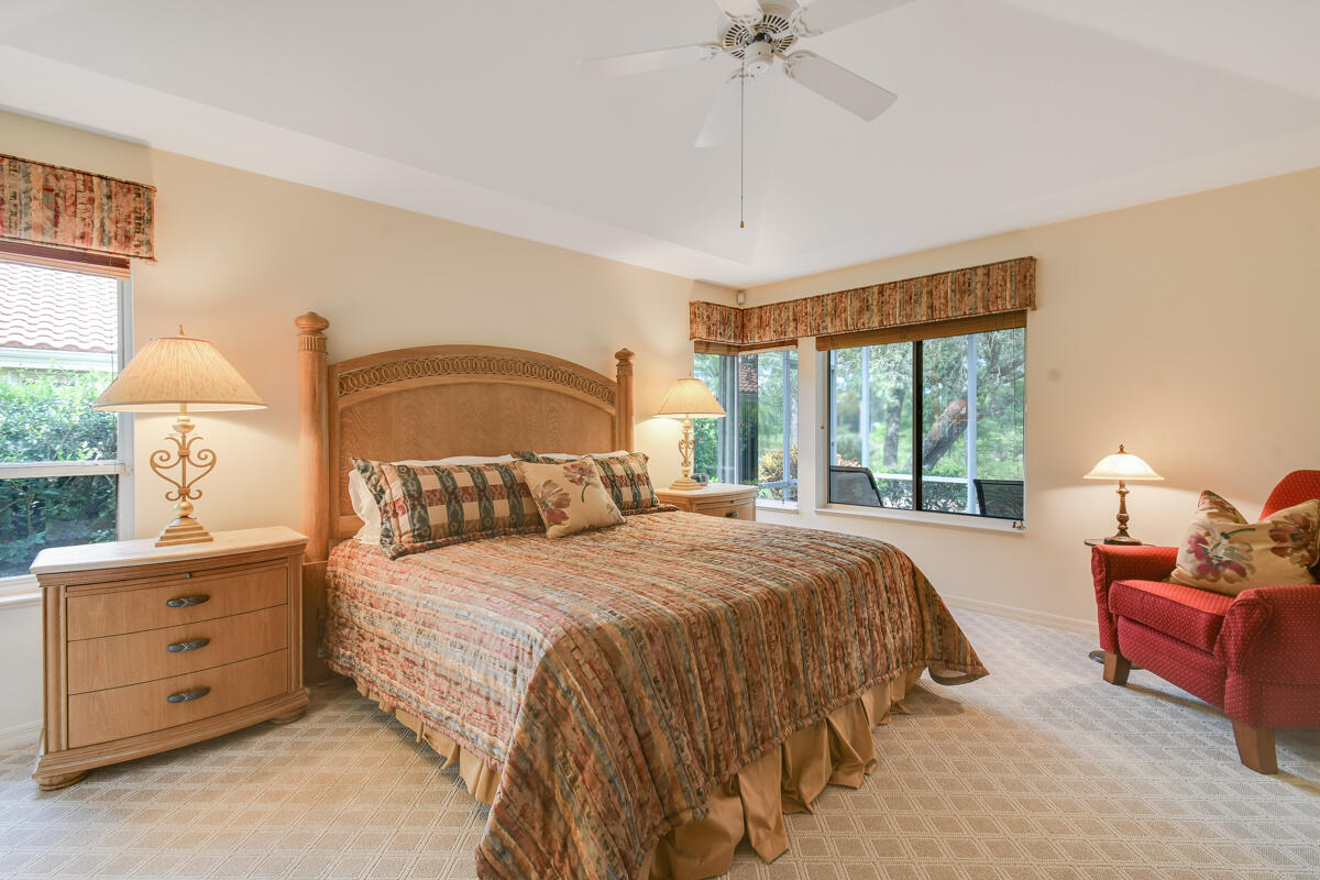 13312 Northwest Maplewood Road Palm City, FL 34990 - Photo 30 of 69 a bedroom with a bed and a window