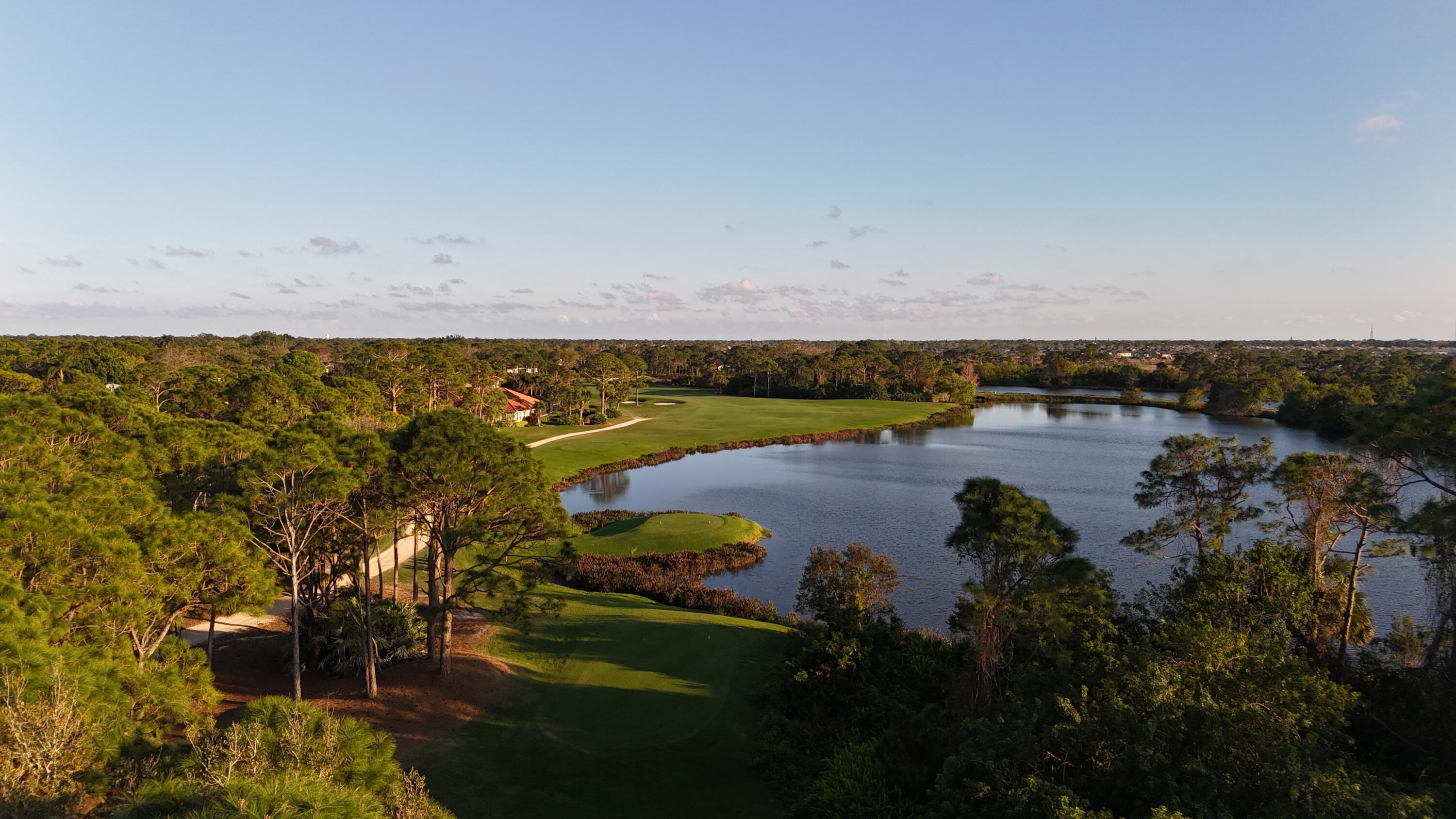 13312 Northwest Maplewood Road Palm City, FL 34990 - Photo 59 of 69 a view of a lake with outdoor space