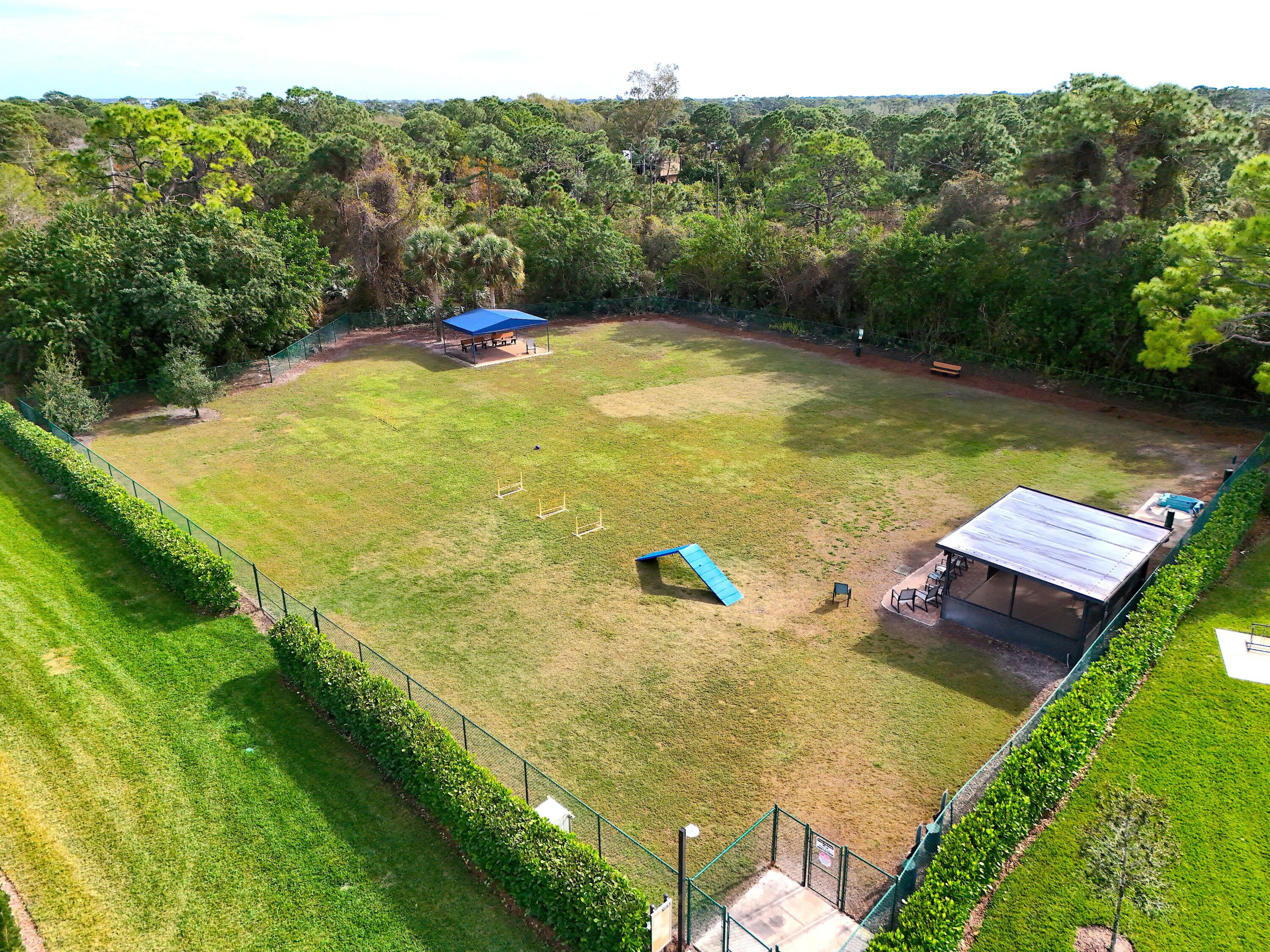 13312 Northwest Maplewood Road Palm City, FL 34990 - Photo 60 of 69 a view of a pool with a yard