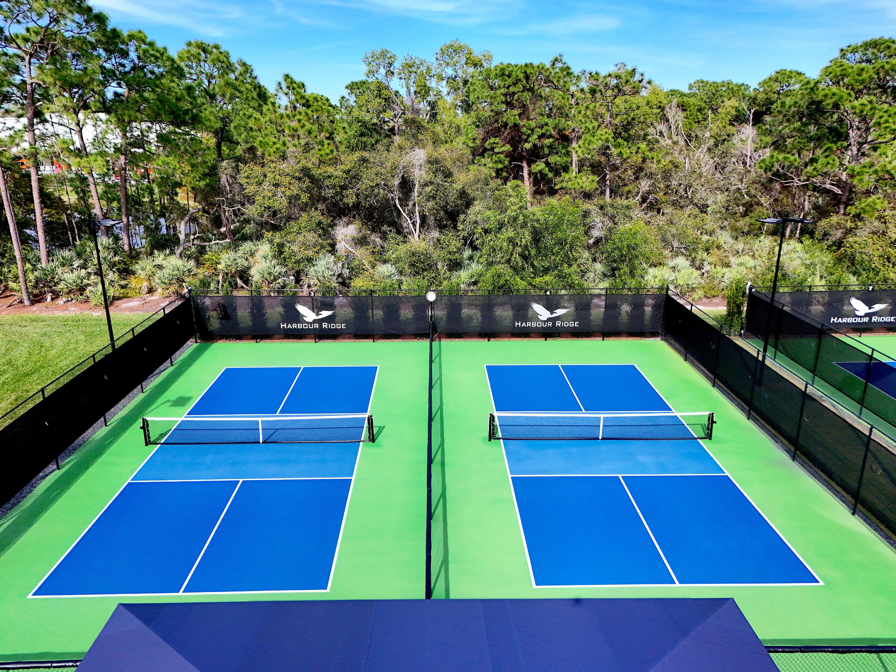13312 Northwest Maplewood Road Palm City, FL 34990 - Photo 63 of 69 a view of yard tennis court